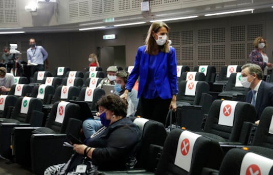 Belgian Prime Minister Sophie Wilmes arrives for a press conference following the National Security Council meeting on the COVID-19 outbreak, in Brussels, Wednesday, Sept. 23, 2020. Belgium's prime minister announced Wednesday a relaxation of social-distancing rules as part of a less stringent long-term coronavirus strategy, despite the steady rise of COVID-19 cases in a country already hard-hit by the virus. (Olivier Hoslet, Pool via AP)