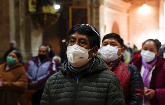 Catholic faithful wearing masks to curb the spread of the new coronavirus attend a Mass at the San Francisco Basilica in La Paz Bolivia, Sunday, Sept. 27, 2020. Churches have reopened for Mass after being closed for months because of the pandemic lockdown. (AP Photo/Juan Karita)