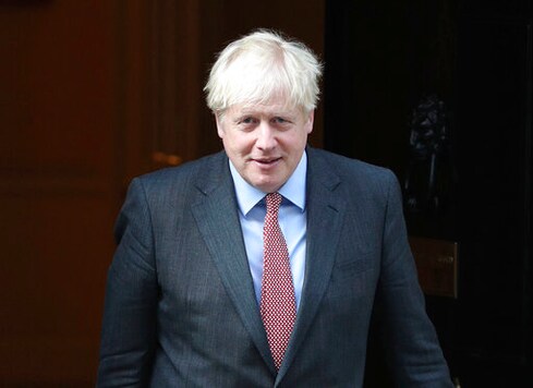 Britain's Prime Minister Boris Johnson leaves 10 Downing Street, London, Monday Sept. 21, 2020. Britains chief medical officers have raised the nations official COVID-19 alert level, meaning the virus is in general circulation and the transmission is high. Boris Johnson is expected to announce further curbs Tuesday to slow the spread of the virus. (Yui Mok/PA via AP)