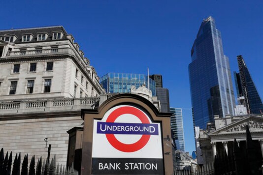 A blue sky over Britain's financial district in London, Monday, Sept. 28, 2020. Lawmakers and scientists have criticized Johnson's Conservative government for problems with the national test-and-trace program that was supposed to help control the spread of the disease and reduce the need for limits on social interactions. (AP Photo/Kirsty Wigglesworth) A blue sky over Britain's financial district in London, Monday, Sept. 28, 2020. Lawmakers and scientists have criticized Johnson's Conservative government for problems with the national test-and-trace program that was supposed to help control the spread of the disease and reduce the need for limits on social interactions. (AP Photo/Kirsty Wigglesworth)
