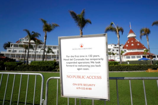FILE - In this June 11, 2020 file photo a sign informing passersby of the hotel's closure is posted outside the Hotel Del Coronado in Coronado, Calif. California's unemployment rate has fallen to 11.4% in August. The Employment Development Department says the state added 101,900 jobs in August. Most of those were government jobs, including temporary positions for the U.S. Census. California lost more than 2.6 million jobs in March and April because of the coronavirus. (AP Photo/Gregory Bull, File) FILE - In this June 11, 2020 file photo a sign informing passersby of the hotel's closure is posted outside the Hotel Del Coronado in Coronado, Calif. California's unemployment rate has fallen to 11.4% in August. The Employment Development Department says the state added 101,900 jobs in August. Most of those were government jobs, including temporary positions for the U.S. Census. California lost more than 2.6 million jobs in March and April because of the coronavirus. (AP Photo/Gregory Bull, File)