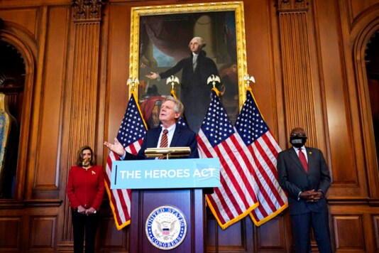 Chairman of the House Energy and Commerce Committee Rep. Frank Pallone, D-N.J., center, speaks next to House Speaker Nancy Pelosi of Calif., left, and House Majority Whip James Clyburn, of S.C., during a news conference about COVID-19, Thursday, Sept. 17, 2020, on Capitol Hill in Washington. (AP Photo/Jacquelyn Martin)
