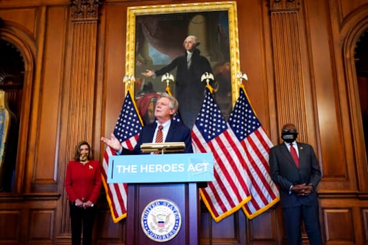 Chairman of the House Energy and Commerce Committee Rep. Frank Pallone, D-N.J., center, speaks next to House Speaker Nancy Pelosi of Calif., left, and House Majority Whip James Clyburn, of S.C., during a news conference about COVID-19, Thursday, Sept. 17, 2020, on Capitol Hill in Washington. (AP Photo/Jacquelyn Martin)