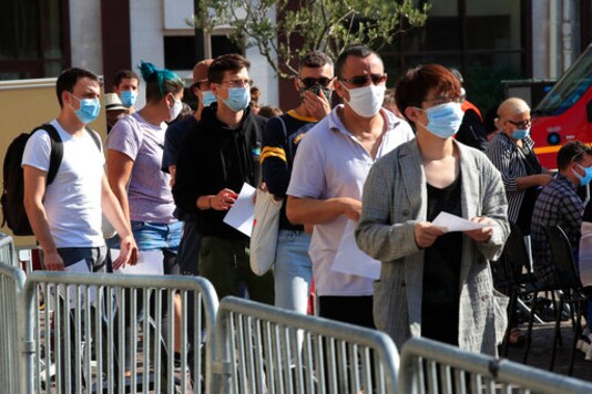 People queue to be tested for the COVID-19 outside a district town-hall in Paris, Monday, Sept.21, 2020. French health authorities have started opening new testing centers in the Paris region to try to reduce queues and delays as the number of infections is steadily increasing in the country. In total, they are planning to open 20 new testing centers in the French capital and in the suburbs this week. (AP Photo/Michel Euler) People queue to be tested for the COVID-19 outside a district town-hall in Paris, Monday, Sept.21, 2020. French health authorities have started opening new testing centers in the Paris region to try to reduce queues and delays as the number of infections is steadily increasing in the country. In total, they are planning to open 20 new testing centers in the French capital and in the suburbs this week. (AP Photo/Michel Euler)