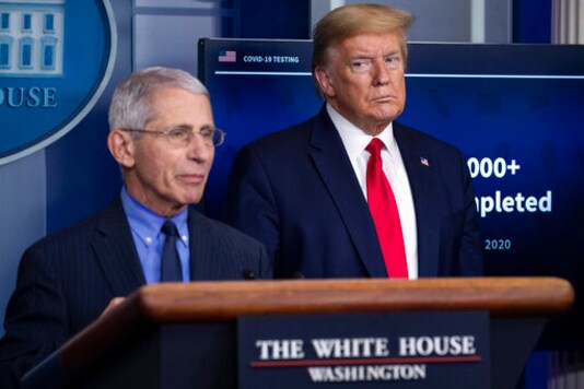 FILE - In this April 17, 2020, file photo Dr. Anthony Fauci, director of the National Institute of Allergy and Infectious Diseases, speaks about the coronavirus, as President Donald Trump listens, in the James Brady Press Briefing Room of the White House in Washington. (AP Photo/Alex Brandon, File)