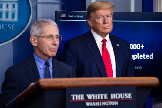 FILE - In this April 17, 2020, file photo Dr. Anthony Fauci, director of the National Institute of Allergy and Infectious Diseases, speaks about the coronavirus, as President Donald Trump listens, in the James Brady Press Briefing Room of the White House in Washington. (AP Photo/Alex Brandon, File) FILE - In this April 17, 2020, file photo Dr. Anthony Fauci, director of the National Institute of Allergy and Infectious Diseases, speaks about the coronavirus, as President Donald Trump listens, in the James Brady Press Briefing Room of the White House in Washington. (AP Photo/Alex Brandon, File)