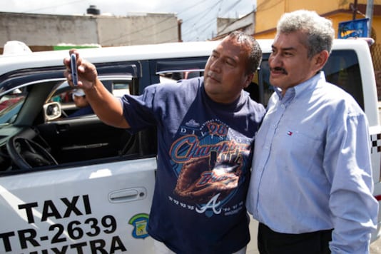 Fabio Rodolfo Vasquez, right, poses with a fan at a promotional event outside a coffee shop, on the outskirts of Guatemala City, Saturday, Sept. 19, 2020. Vasquez and his wife, Maria Moreno, entered an online dance contest during the new coronavirus pandemic to help them cope with the recent death of their daughter and won it. (AP Photo/Moises Castillo) Fabio Rodolfo Vasquez, right, poses with a fan at a promotional event outside a coffee shop, on the outskirts of Guatemala City, Saturday, Sept. 19, 2020. Vasquez and his wife, Maria Moreno, entered an online dance contest during the new coronavirus pandemic to help them cope with the recent death of their daughter and won it. (AP Photo/Moises Castillo)