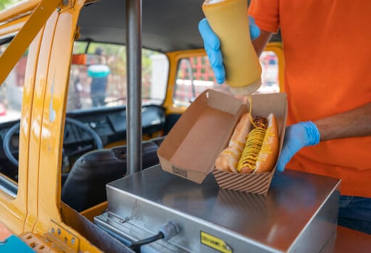 Emad Abdeljawwad sells hot dogs and beverages out of a converted van in the West Bank city of Ramallah, Wednesday, Sept. 23, 2020. The coronavirus crisis has hit West Bank restaurants hard. But one part of the dining sector is bucking the trend: food trucks. (AP Photo/Nasser Nasser)