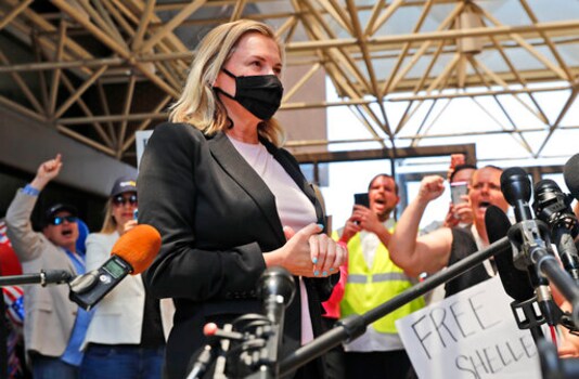 Salon owner Shelley Luther begins to speak to the media after she was released from jail in Dallas, Thursday, May 7, 2020. Luther was jailed for refusing to keep her business closed amid concerns of the spread of COVID-19. (AP Photo/LM Otero)