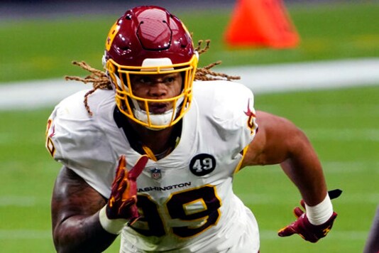 Washington Football Team defensive end Chase Young (99) is shown during an NFL football game against the Arizona Cardinals, Sunday, Sept. 20, 2020, in Glendale, Ariz. The last time Baker Mayfield faced a talented, quarterback-seeking defensive line anchored by the No. 2 overall draft pick, things didn't go well. The San Francisco 49ers menaced and mauled Mayfield last season. On Sunday the Browns' QB faces Washington's ferocious front.(AP Photo/Rick Scuteri, File) Washington Football Team defensive end Chase Young (99) is shown during an NFL football game against the Arizona Cardinals, Sunday, Sept. 20, 2020, in Glendale, Ariz. The last time Baker Mayfield faced a talented, quarterback-seeking defensive line anchored by the No. 2 overall draft pick, things didn't go well. The San Francisco 49ers menaced and mauled Mayfield last season. On Sunday the Browns' QB faces Washington's ferocious front.(AP Photo/Rick Scuteri, File)