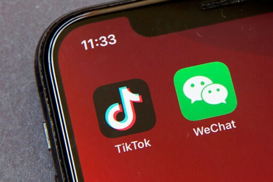 FILE - Icons for the smartphone apps TikTok and WeChat are seen on a smartphone screen in Beijing, in a Friday, Aug. 7, 2020 file photo. The Commerce Department said President Trumps proposed ban of the apps WeChat and TikTok will go into effect Sunday, Sept. 20, to safeguard the national security of the United States. The government said its order, previously announced by Trump in August, will combat Chinas malicious collection of American citizens personal data. (AP Photo/Mark Schiefelbein, File) FILE - Icons for the smartphone apps TikTok and WeChat are seen on a smartphone screen in Beijing, in a Friday, Aug. 7, 2020 file photo. The Commerce Department said President Trumps proposed ban of the apps WeChat and TikTok will go into effect Sunday, Sept. 20, to safeguard the national security of the United States. The government said its order, previously announced by Trump in August, will combat Chinas malicious collection of American citizens personal data. (AP Photo/Mark Schiefelbein, File)