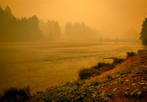 FILE - In this Sept. 10, 2020, file photo, the McKenzie River flows through a drained Leaburg Lake near Leaburg, Ore. Oregonians are grieving the loss of some of their most treasured natural places after wildfires wiped out campgrounds, hot springs and wooded retreats that have been a touchstone for generations in a state known for its unspoiled beauty. (Andy Nelson/The Register-Guard via AP, File)
