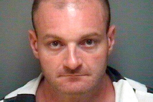 FILE - This undated booking file photo provided by the Albemarle-Charlottesville Regional Jail shows Christopher Cantwell, of New Hampshire. Cantwell went on trial Tuesday, Sept. 22, 2020, on federal charges of threatening to rape the wife of a person with whom he was having a dispute.  (Albemarle-Charlottesville Regional Jail via AP, File)