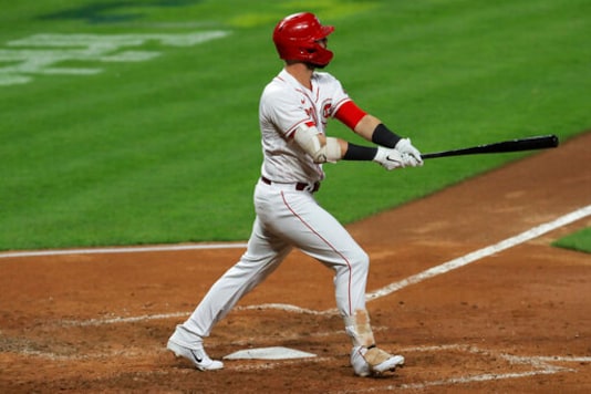 Cincinnati Reds' Jesse Winker watches his three-run home run duirng the third inning of the team's baseball game against the Chicago White Sox in Cincinnati, Friday, Sept. 18, 2020. (AP Photo/Aaron Doster)