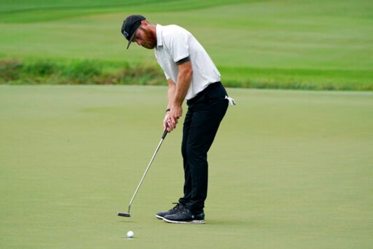 Tyler Mccumber putts on the seventh hole during the second round of the Wyndham Championship golf tournament at Sedgefield Country Club on Friday, Aug. 14, 2020, in Greensboro, N.C. (AP Photo/Chris Carlson) Tyler Mccumber putts on the seventh hole during the second round of the Wyndham Championship golf tournament at Sedgefield Country Club on Friday, Aug. 14, 2020, in Greensboro, N.C. (AP Photo/Chris Carlson)