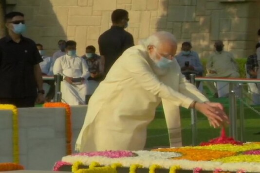 Prime Minister Narendra Modi pays tribute to Mahatma Gandhi at Raj Ghat.