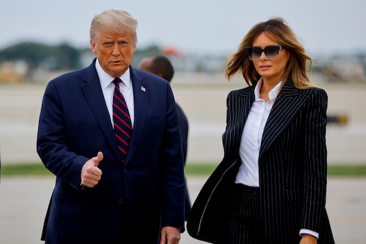 US President Donald Trump walks with first lady Melania Trump at Cleveland Hopkins International Airport in Cleveland, Ohio on September 29, 2020. (REUTERS/Carlos Barria)