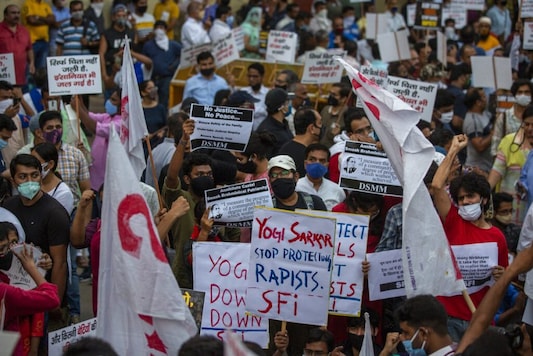 Protestors gather to raise their voices against the gang rape and killing of a woman in India's northern state of Uttar Pradesh, in New Delhi, India, Friday, Oct. 2, 2020. Hundreds of protesters on Friday demanded the dismissal of a Hindu nationalist government in a northern Indian state where a 19-year-old woman from India’s lowest caste was allegedly gang raped and brutally attacked last month and later died in a hospital. They carried placards and shouted slogans ``Hang the rapists” and ``First raped by devils, then by the system” as they assembled at ``Jantar Mantar”, the main area for protests close to Parliament in New Delhi. (AP Photo/Altaf Qadri) Protestors gather to raise their voices against the gang rape and killing of a woman in India's northern state of Uttar Pradesh, in New Delhi, India, Friday, Oct. 2, 2020. Hundreds of protesters on Friday demanded the dismissal of a Hindu nationalist government in a northern Indian state where a 19-year-old woman from India’s lowest caste was allegedly gang raped and brutally attacked last month and later died in a hospital. They carried placards and shouted slogans ``Hang the rapists” and ``First raped by devils, then by the system” as they assembled at ``Jantar Mantar”, the main area for protests close to Parliament in New Delhi. (AP Photo/Altaf Qadri)