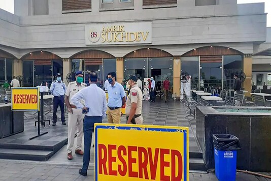 Police and health officials outside the famous Amrik Sukhdev Dhaba in Murthal, Haryana. (Photo: PTI)