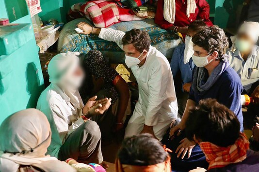 Congress leaders Priyanka and Rahul Gandhi meet the family members of the Dalit woman who died after being allegedly raped, in Hathras on Saturday. (PTI)