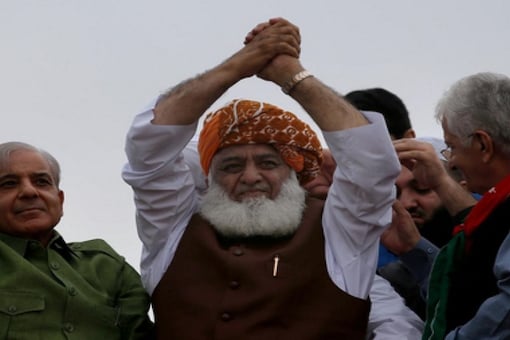 Pakistan's firebrand cleric-cum-politician Maulana Fazlur Rehman has been unanimously appointed as the first president of the Opposition's newly-formed anti-government alliance Pakistan Democratic Movement (PDM), (Image: News18)