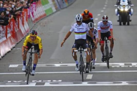Slovenian Primoz Roglic, left, of the Jumbo - Visma team crosses the finish line to win the Belgian cycling classic and UCI World Tour race Liege Bastogne Liege, in Liege (Photo Credit: AP) Slovenian Primoz Roglic, left, of the Jumbo - Visma team crosses the finish line to win the Belgian cycling classic and UCI World Tour race Liege Bastogne Liege, in Liege (Photo Credit: AP)
