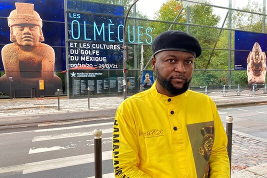 Congolese activist Mwazulu Diyabanza poses in front of the Quai Branly Museum-Jacques Chirac, a museum featuring indigenous art and cultures of Africa, Asia, Oceania and the Americas, in Paris, France, October 2, 2020.  REUTERS/Yiming Woo