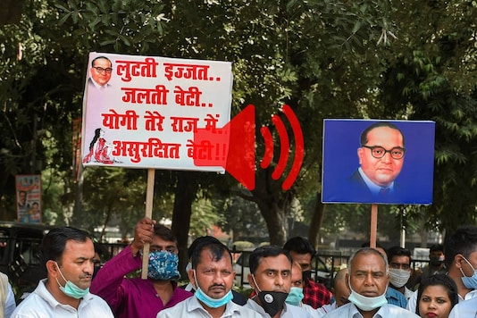 A protest against the UP Police's mishandling of the Hathras rape case. (Photo: PTI) A protest against the UP Police's mishandling of the Hathras rape case. (Photo: PTI)