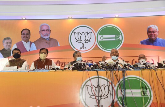 JD(U) chief Nitish Kumar with BJP leader Sushil Modi addresses a press conference of NDA in Patna on Tuesday. (PTI)