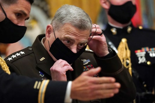 FILE PHOTO: Chairman of the Joint Chiefs of Staff Gen. Mark Milley puts his face mask back on after a ceremony where U.S. President Donald Trump presented the Medal of Honor to U.S. Army Sgt. Maj. Thomas P. Payne for conspicuous gallantry during a hostage rescue mission in Iraq, at the White House in Washington, U.S., September 11, 2020. REUTERS/Kevin Lamarque FILE PHOTO: Chairman of the Joint Chiefs of Staff Gen. Mark Milley puts his face mask back on after a ceremony where U.S. President Donald Trump presented the Medal of Honor to U.S. Army Sgt. Maj. Thomas P. Payne for conspicuous gallantry during a hostage rescue mission in Iraq, at the White House in Washington, U.S., September 11, 2020. REUTERS/Kevin Lamarque