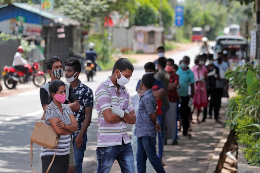 Sri Lankans wait to give swab samples to test for COVID-19 outside a hospital in Minuwangoda, Sri Lanka, Tuesday, Oct. 6, 2020. (AP Photo/Eranga Jayawardena) Sri Lankans wait to give swab samples to test for COVID-19 outside a hospital in Minuwangoda, Sri Lanka, Tuesday, Oct. 6, 2020. (AP Photo/Eranga Jayawardena)