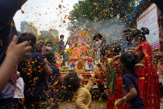 Devotees celebrate Ganesh Chaturthi in Mumbai. (Reuters)