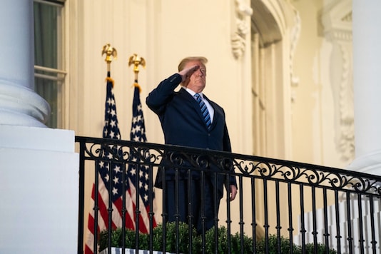 President Donald Trump stands on the Truman Balcony after returning to the White House from treatment for Covid-19 infection, in Washington on October 5, 2020. (Anna Moneymaker/The New York Times) President Donald Trump stands on the Truman Balcony after returning to the White House from treatment for Covid-19 infection, in Washington on October 5, 2020. (Anna Moneymaker/The New York Times)