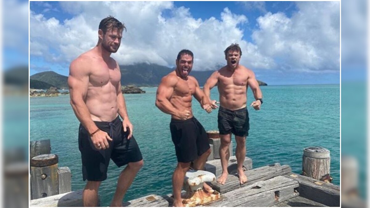 Chris Hemsworth Shows Off Insanely Ripped Body on Beach Vacation with