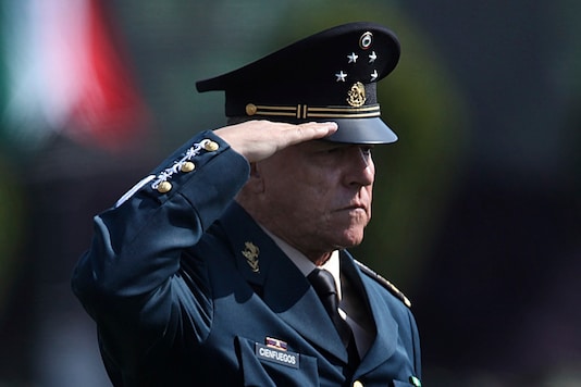 FILE - In this April 16, 2016 file photo, Mexico's Defense Secretary Gen. Salvador Cienfuegos Zepeda salutes soldiers at the Number 1 military camp in Mexico City. (AP Photo/Marco Ugarte, File) FILE - In this April 16, 2016 file photo, Mexico's Defense Secretary Gen. Salvador Cienfuegos Zepeda salutes soldiers at the Number 1 military camp in Mexico City. (AP Photo/Marco Ugarte, File)