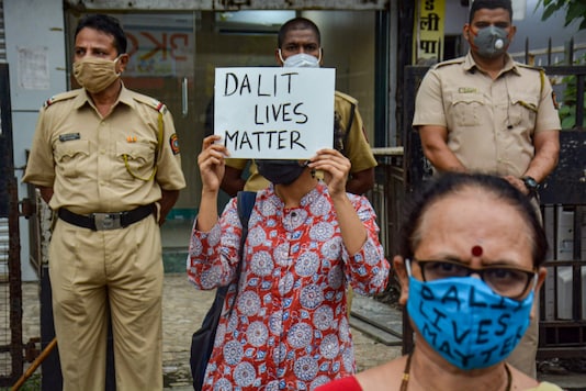 Police stand guard as members of civil society organisations protest for justice in the Hathras gang-rape and murder case, in Thane, on October 11, 2020. (Representative image/PTI) Police stand guard as members of civil society organisations protest for justice in the Hathras gang-rape and murder case, in Thane, on October 11, 2020. (Representative image/PTI)