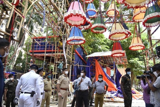 Kolkata Police Commissioner Anuj Sharma takes stock of the arrangements at under-construction Durga Puja pandals. Kolkata Police Commissioner Anuj Sharma takes stock of the arrangements at under-construction Durga Puja pandals.