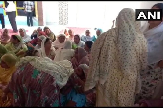 Balwinder Singh Sandhu’s family and friends in mourning on Saturday. (Twitter/@ANI) Balwinder Singh Sandhu’s family and friends in mourning on Saturday. (Twitter/@ANI)
