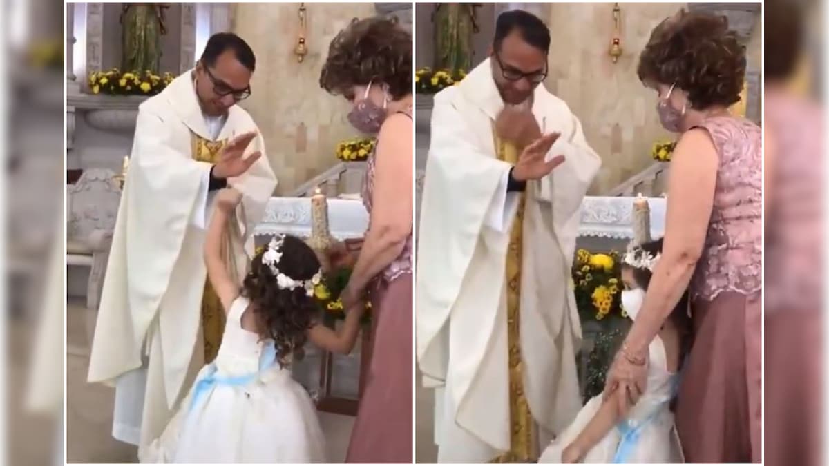 WATCH: Priest Raises Hand to Give Blessings, Kid Finds it the Apt Moment for a High-Five