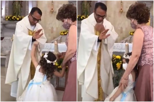Screengrab of viral video showing the girl giving a high-five to the priest. Screengrab of viral video showing the girl giving a high-five to the priest.