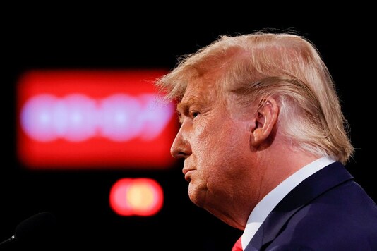 U.S. President Donald Trump listens during the third and final presidential debate with Democratic presidential nominee Joe Biden at Belmont University in Nashville, Tennessee, U.S., October 22, 2020. REUTERS/Jim Bourg/Pool
