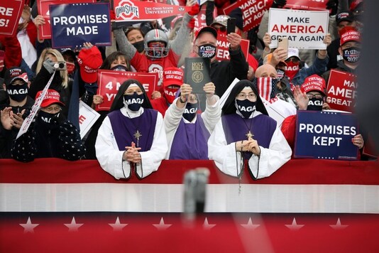 Supporters look on as U.S. President Donald Trump delivers remarks during a campaign event at the Pickaway Agriculture and Event Center in Circleville, Ohio, U.S., October 24, 2020. REUTERS/Tom Brenner
Supporters look on as U.S. President Donald Trump delivers remarks during a campaign event at the Pickaway Agriculture and Event Center in Circleville, Ohio, U.S., October 24, 2020. REUTERS/Tom Brenner