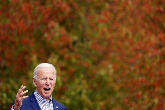 U.S. Democratic presidential candidate Joe Biden speaks during a drive-in campaign event at Bucks County Community College in Bristol, Pennsylvania, U.S., October 24, 2020. REUTERS/Kevin Lamarque
