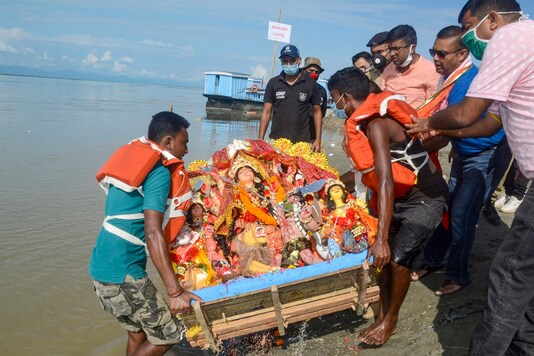 File photo of devotees carrying an idol of Goddess Durga for immersion on 'Vijay Dashami' during the Durga Puja festival. (PTI)