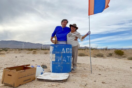 John Hunter, a supporter of U.S. President Donald Trump, and his wife Laura, who doesn't support Trump, put their political differences aside to set up water stations for people illegally crossing the US-Mexico border, in Borrego Springs, California , U.S., October 24, 2020. REUTERS/Norma Galeana