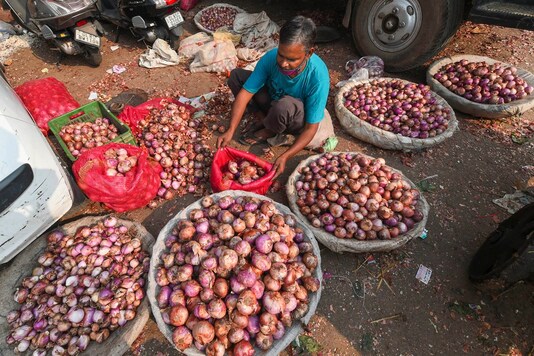 New Delhi: A shop keeper sorts onion while waiting for customers at Azadpur Sabzi Mandi in New Delhi, Monday, Oct 26, 2020. Onion prices continue to rise nationwide. (PTI Photo/Shahbaz Khan)