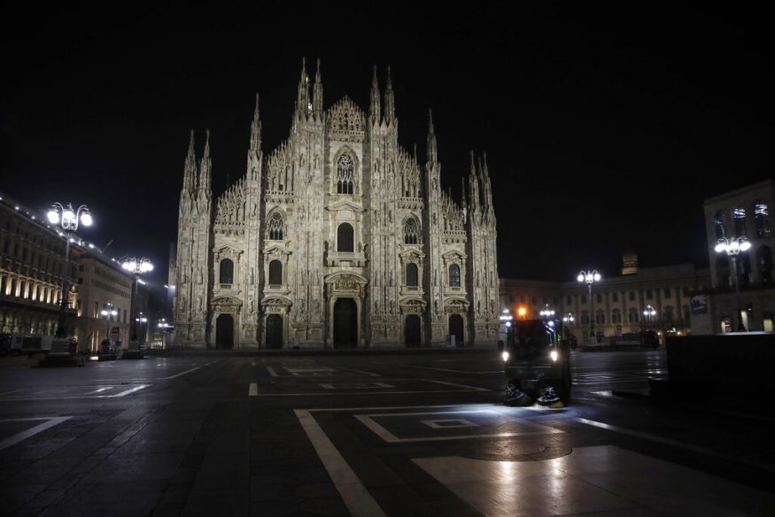  After 11 p.m., Milan is a ghost town. The piazzas are empty, the streets dark and quiet. In this photo, A street cleaning vehicle is seen washing the square in front of the Duomo gothic cathedral, in Milan, northern Italy. (Image: AP)