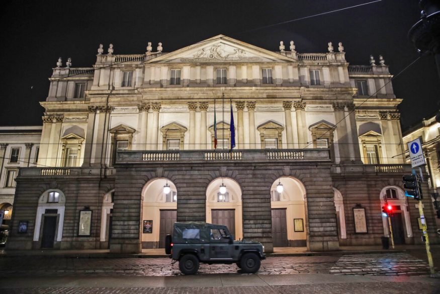 A military vehicle drives past La Scala opera theater in Milan, Italy. (Image: AP)