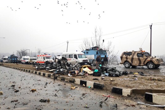 Indian soldiers examine the debris after an explosion in Lethpora in south Kashmir's Pulwama district on February 14, 2019. (File/REUTERS/Younis Khaliq)