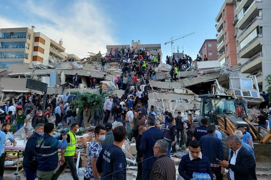 Locals and officials search for survivors at a collapsed building after a strong earthquake struck the Aegean Sea on Friday and was felt in both Greece and Turkey. (Image: Reuters) Locals and officials search for survivors at a collapsed building after a strong earthquake struck the Aegean Sea on Friday and was felt in both Greece and Turkey. (Image: Reuters)